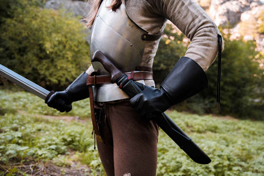 Black leather messer knife sheath carried on a belt loop with a long hanger-blade knife inside