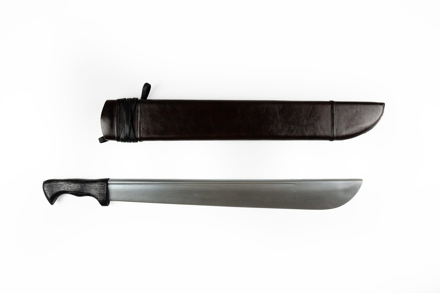 Brown leather falchion knife sheath next to the straight machete blade it is made for
