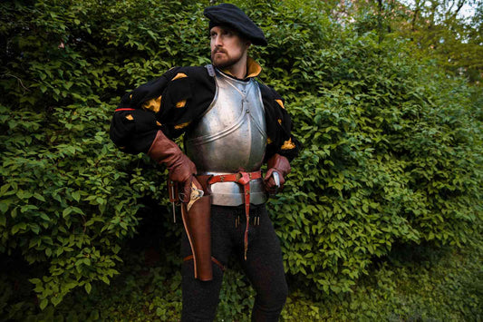 LARP soldier in blackover-under holster close-up detail with brass accents leather armor with over-under holster medieval costume