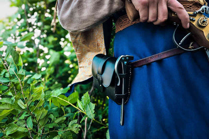 LARP blaster holster worn on character with steel ramrod accessory outdoor medieval costume