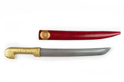 Khanjar dagger with curved steel blade and brass handle beside its red leather sheath