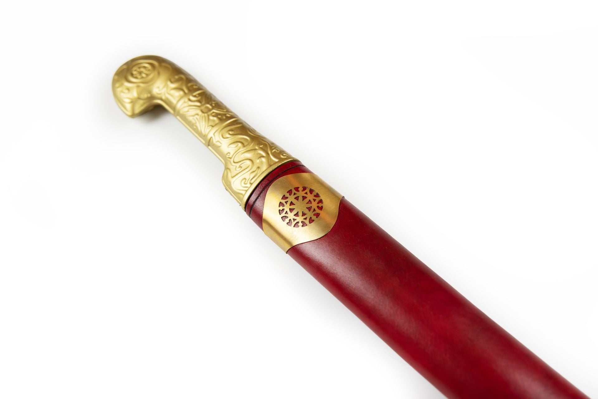 Ornate brass handle of a Khanjar dagger with red leather sheath