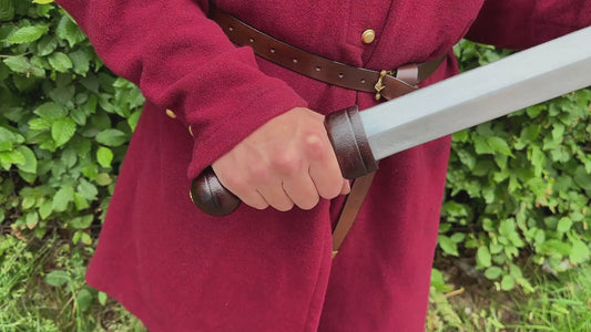 Video of person holding Gladius sword with wooden grip and pommel