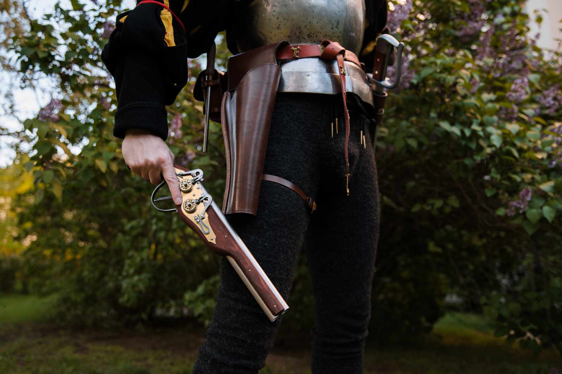 LARP warrior with over-under holster and pistol outdoor closeup