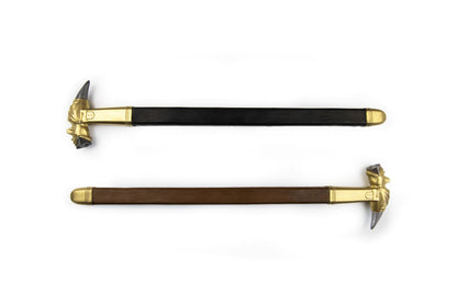 Two dragon hammer weapons with brass dragon heads and black wooden handles on white background
