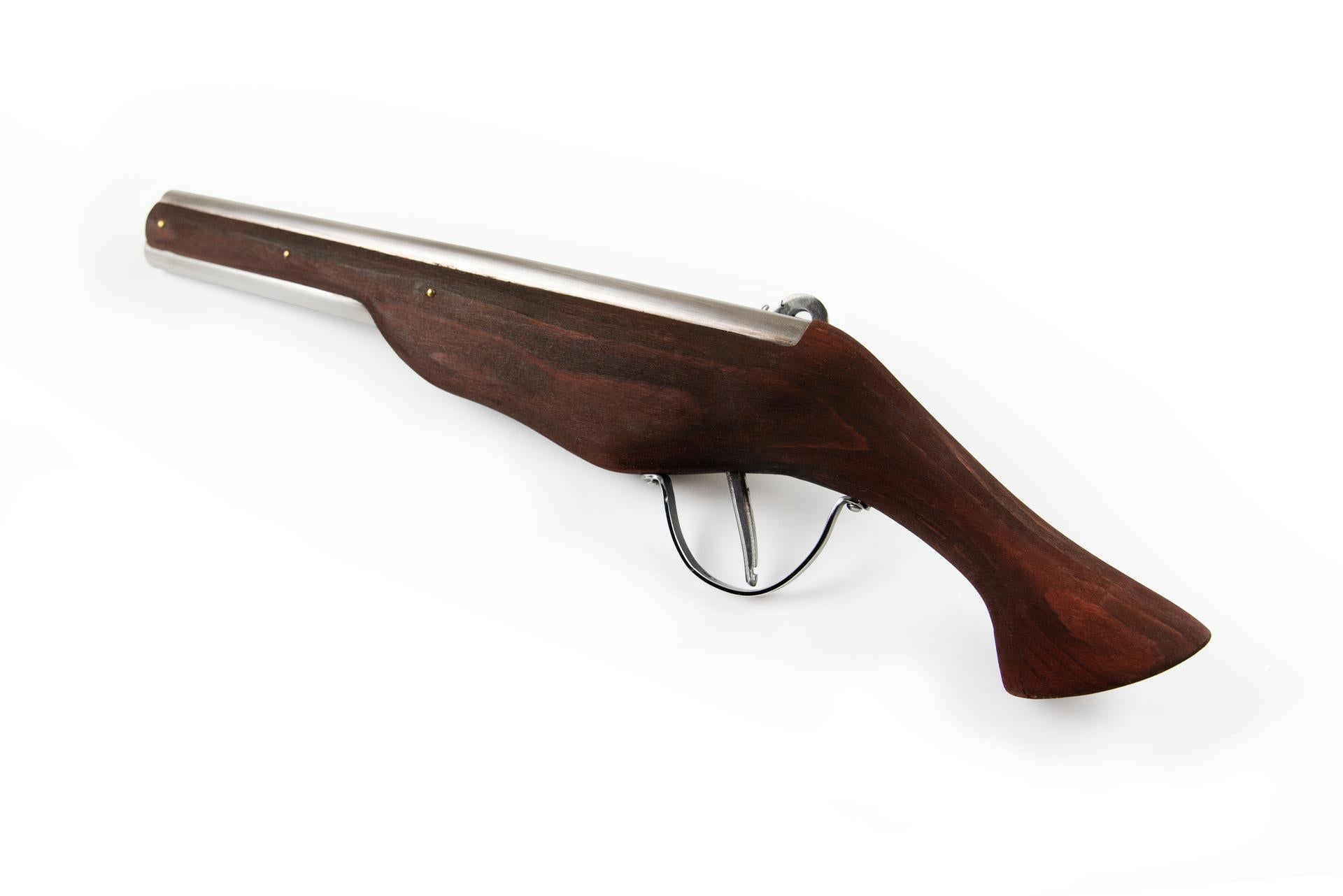 Wheellock blaster pistol back view showing wooden stock and brass wheellock mechanism medieval LARP